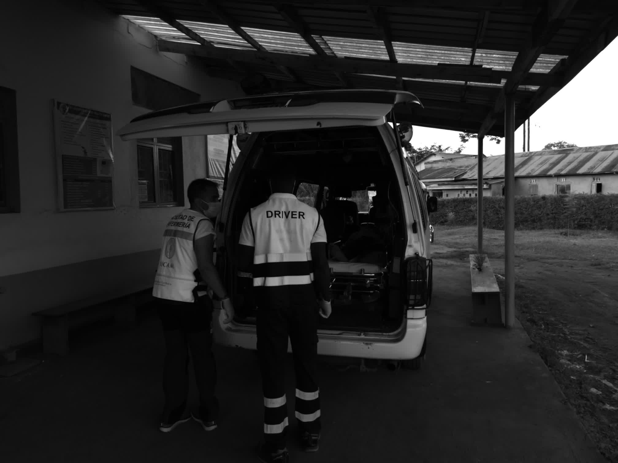Health staff preparing a patient transfer in the Kikaya Medical Center ambulance, Uganda